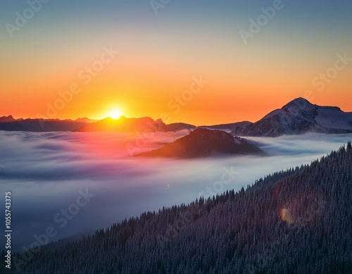 Colorful winter sunrise in the foggy mountains