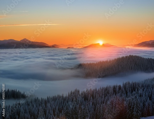 Colorful winter sunrise in the foggy mountains