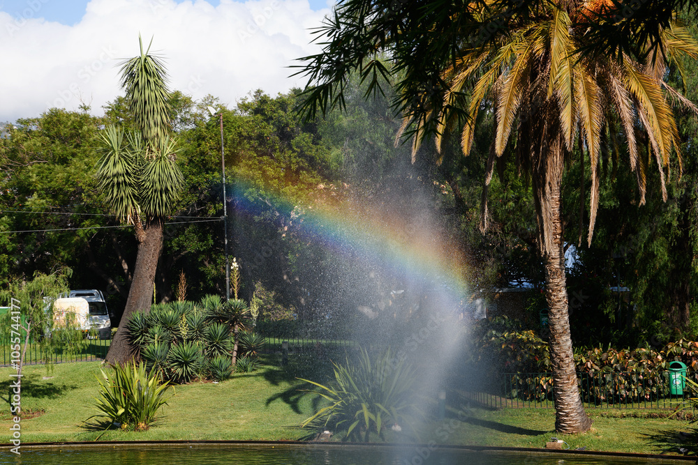 rainbow in the fountain in the Santa Catarina Park in Funchal (Madeira, Portugal)