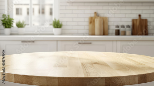 Round wooden table with sunlight shining on it, with a blurred background of a kitchen.