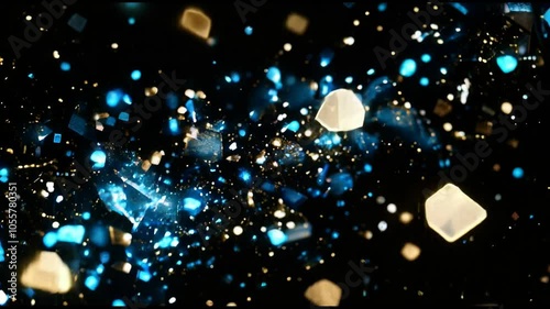 Glowing Particles in Blue and Gold on Black Background