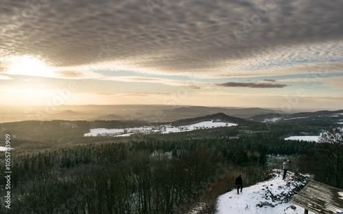 The ruins of Kumburk Castle offer a breathtaking view of the Czech landscape, blanketed in snow. photo