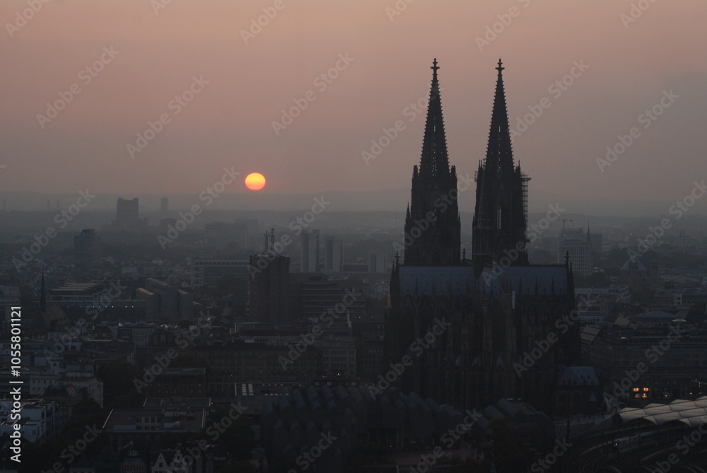 Naklejka premium Sunset with two high church towers.