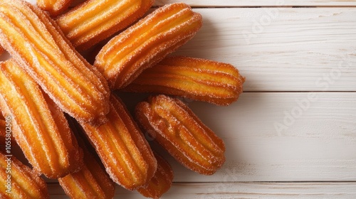 Homemade churros displayed on a white wooden surface photo