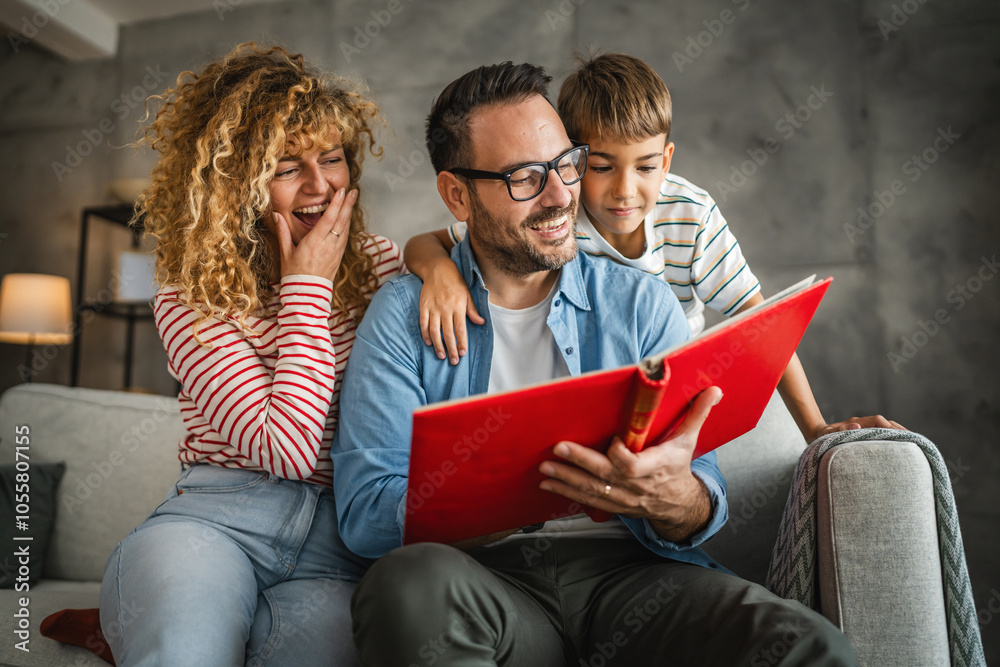 mum, dad and son enjoy while look together family album with photos mum, dad and son enjoy while look together family album with photos