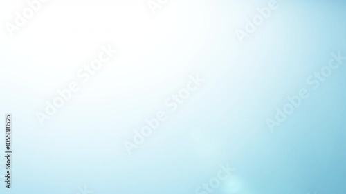 Abstract blue lens flare overlay appearing on black background. Slow motion. 