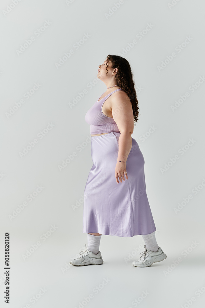 An elegant plus size woman walks with confidence, showcasing her beauty and style. An elegant plus size woman walks with confidence, showcasing her beauty and style.
