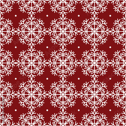 Seamless pattern of white Christmas snowflakes on a red background