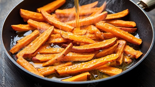 Crispy Golden Sweet Potato Fries Cooking in Pan