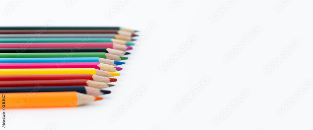 multicolored pencils on a white background with a place to copy