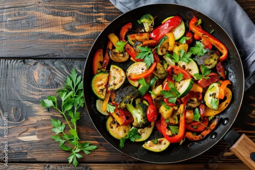 Top view of vegetable saute in frying pan on wood background