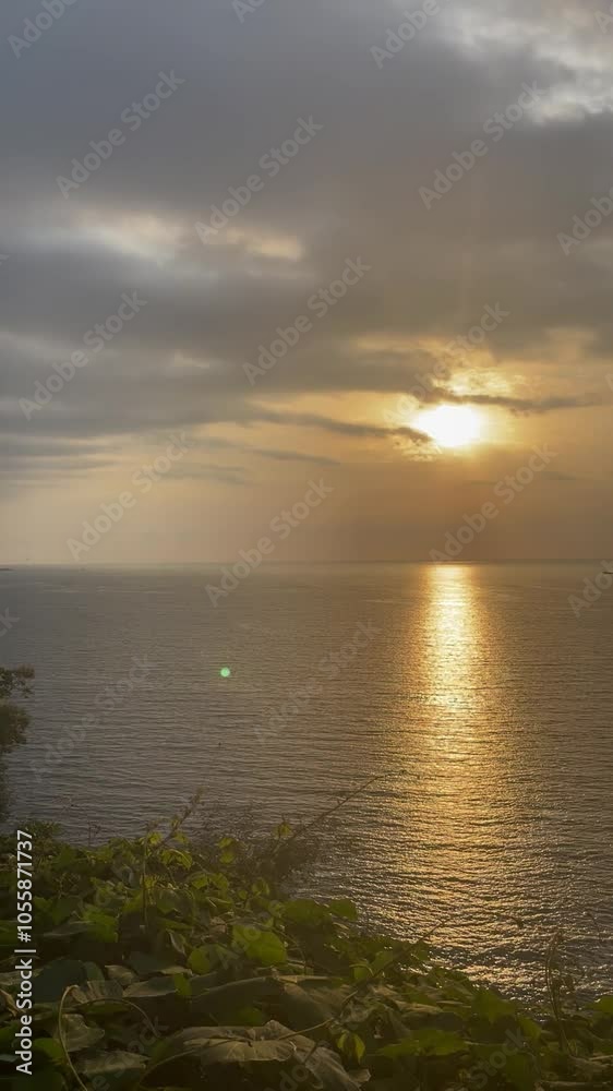 reflection of sunset in a quiet sea reflection of sunset in a quiet sea
