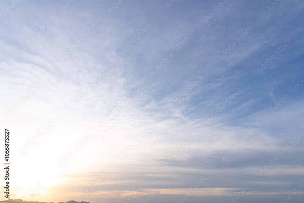 Beautiful morning or evening blue and orange sky while sunsets or sunrises taken at the sea used as natural blackground texture Beautiful morning or evening blue and orange sky while sunsets or sunrises taken at the sea used as natural blackground texture