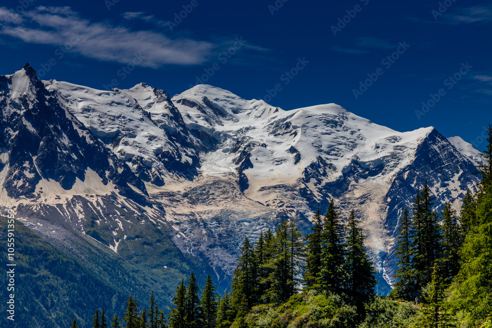 Mont Blanc, Monte Bianco mountain summit snow dome above the Chamonix valley in France. Highest peak in Europe in the Alps, alpice scenic view of Montblanc Mont Blanc, Monte Bianco mountain summit snow dome above the Chamonix valley in France. Highest peak in Europe in the Alps, alpice scenic view of Montblanc