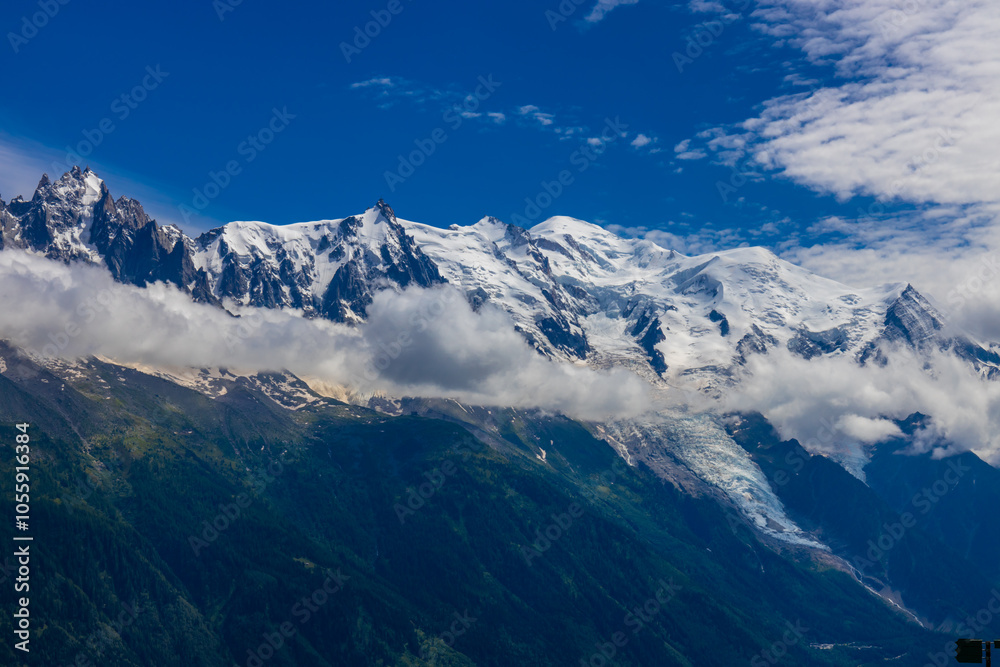 Mont Blanc, Monte Bianco mountain summit snow dome above the Chamonix valley in France. Highest peak in Europe in the Alps, alpice scenic view of Montblanc Mont Blanc, Monte Bianco mountain summit snow dome above the Chamonix valley in France. Highest peak in Europe in the Alps, alpice scenic view of Montblanc