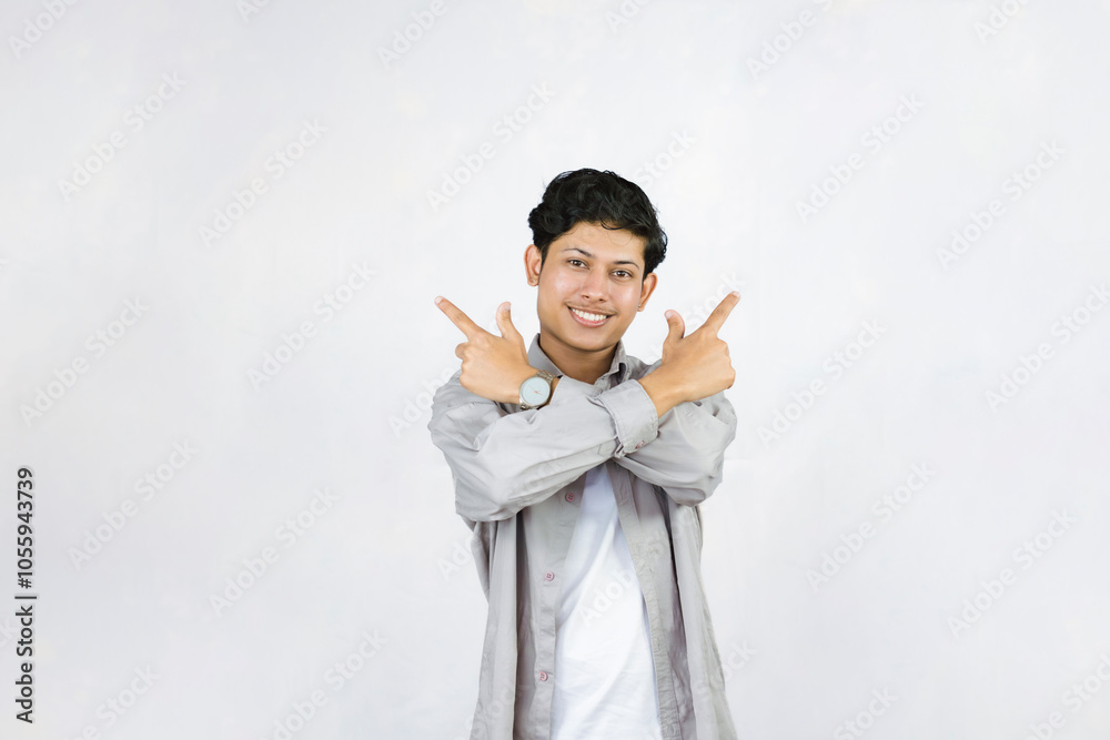 Young Teenager in shirt and vest gives expression of happiness and sadness points with gestures with hands