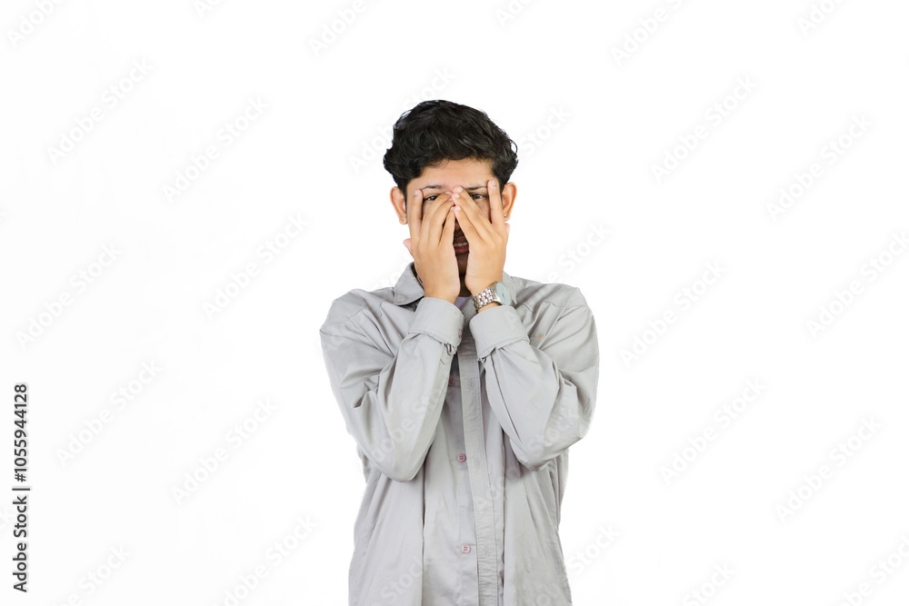 Young Teenager in shirt and vest gives expression of happiness and sadness points with gestures with hands Young Teenager in shirt and vest gives expression of happiness and sadness points with gestures with hands