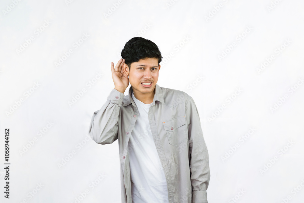 Young Teenager in shirt and vest gives expression of happiness and sadness points with gestures with hands Young Teenager in shirt and vest gives expression of happiness and sadness points with gestures with hands