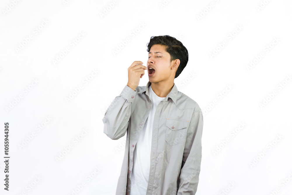 Young Teenager in shirt and vest gives expression of happiness and sadness points with gestures with hands Young Teenager in shirt and vest gives expression of happiness and sadness points with gestures with hands