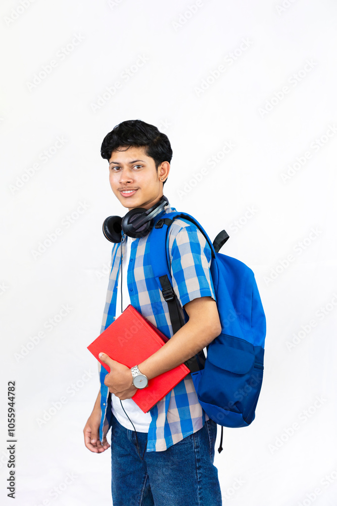 Young Male Study Abroad Concept with Bag, Books and headphone gives expression and gestures Student Young Male Study Abroad Concept with Bag, Books and headphone gives expression and gestures Student