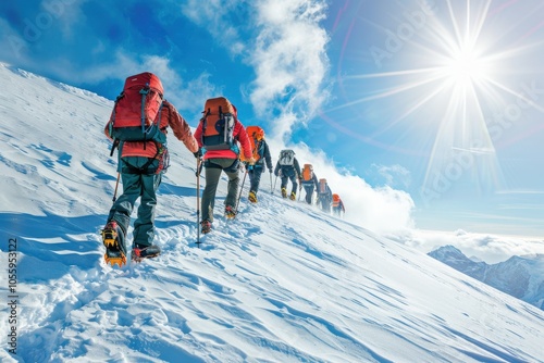 Hikers Ascending a Snow-Covered Mountain Ridge under a Bright Sun