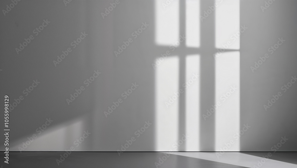 Sunlit window casting geometric shadows on a plain wall surface Sunlit window casting geometric shadows on a plain wall surface