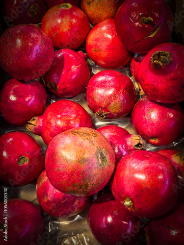 Vivid colors of autumn in food produce - pomegranates.