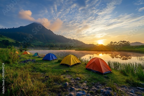 a magnificent view of golden hour at sunset at campsite at the peak of Pangasinan hills, Lombok Indonesia.
 photo