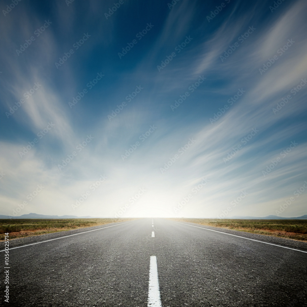 Fototapeta premium a straight road stretching into the horizon across a deserted land cloudy weather