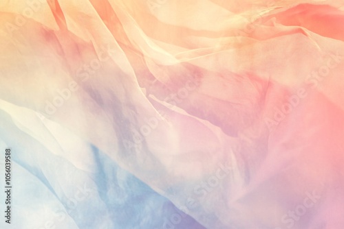 Soft fabric in blue, white, and red hues gracefully folds over each other, creating a beautiful textured display during afternoon light