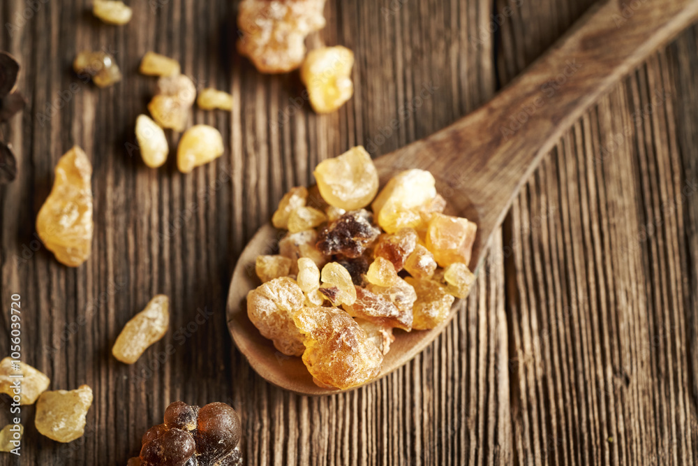 Frankincense or boswellia resin on wooden spoon Frankincense or boswellia resin on wooden spoon