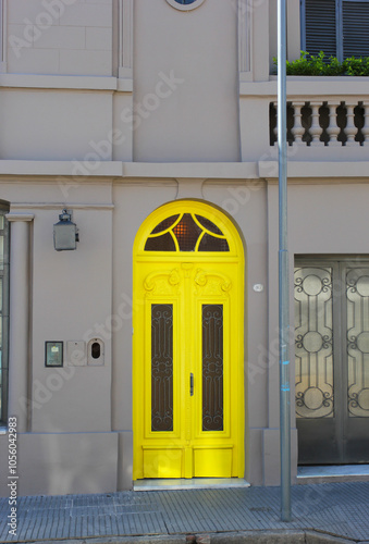 The bright yellow front door in San Nicolas, Argentina