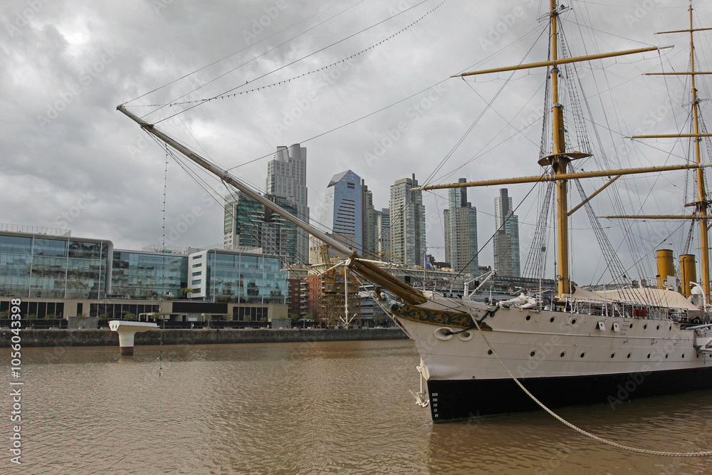 The boat standing in the harbor of Buenos Aires with skyscrapers in the background The boat standing in the harbor of Buenos Aires with skyscrapers in the background