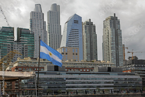 The Argentina flag with Buenos Aires skyscrapers in the background