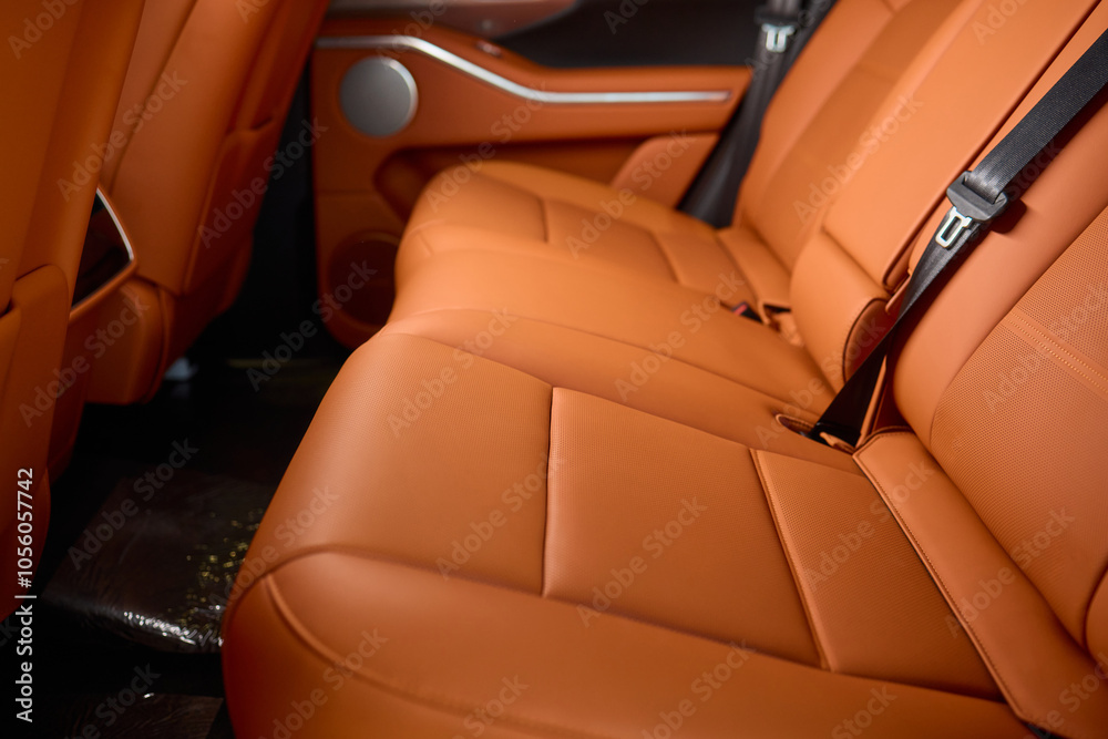 Fototapeta premium Indulge in Luxurious Orange Leather Car Seats that feature a Unique and Stylish Design