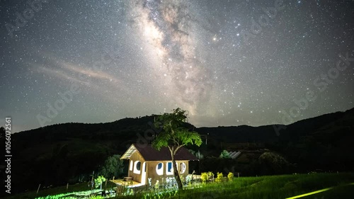The Milky Way and a hut in the middle of a rice field at Rai Khun Pae, Chiang Mai