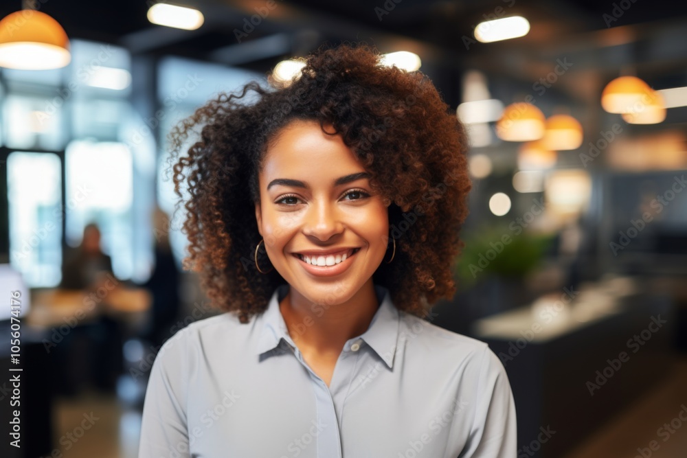 Smiling portrait of a young African American businesswoman in office Smiling portrait of a young African American businesswoman in office
