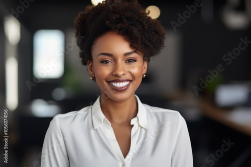 Smiling portrait of a young African American businesswoman in office