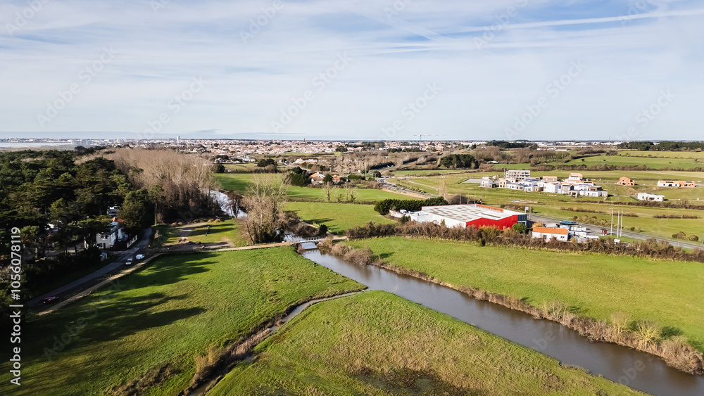 Aerial drone view of a flood zone along the Jaunay River near Givrand, France on a beautiful winter day