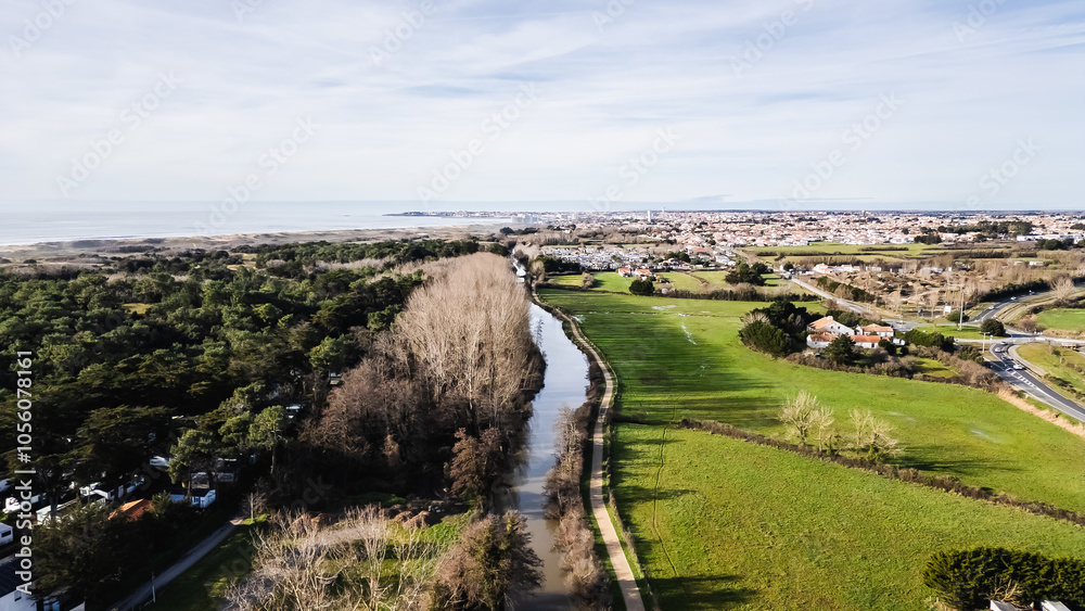 Aerial drone view of a flood zone along the Jaunay River near Givrand, France on a beautiful winter day