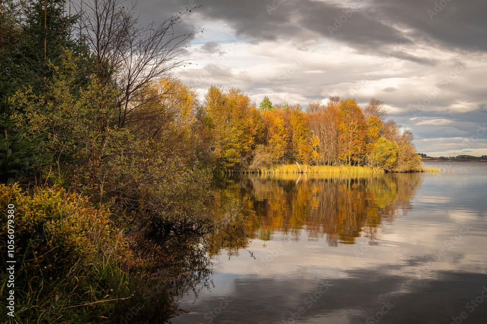 Fototapeta premium An overcast, still, autumnal HDR image of Loch Ashie on Drumashie moor in the Great Glen, Inverness-shire, Scotland