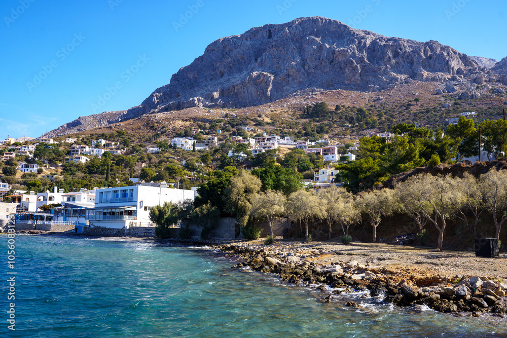 Fototapeta premium View over the coast of Myrties, Kalymnos, Greece to the famous climbing rocks