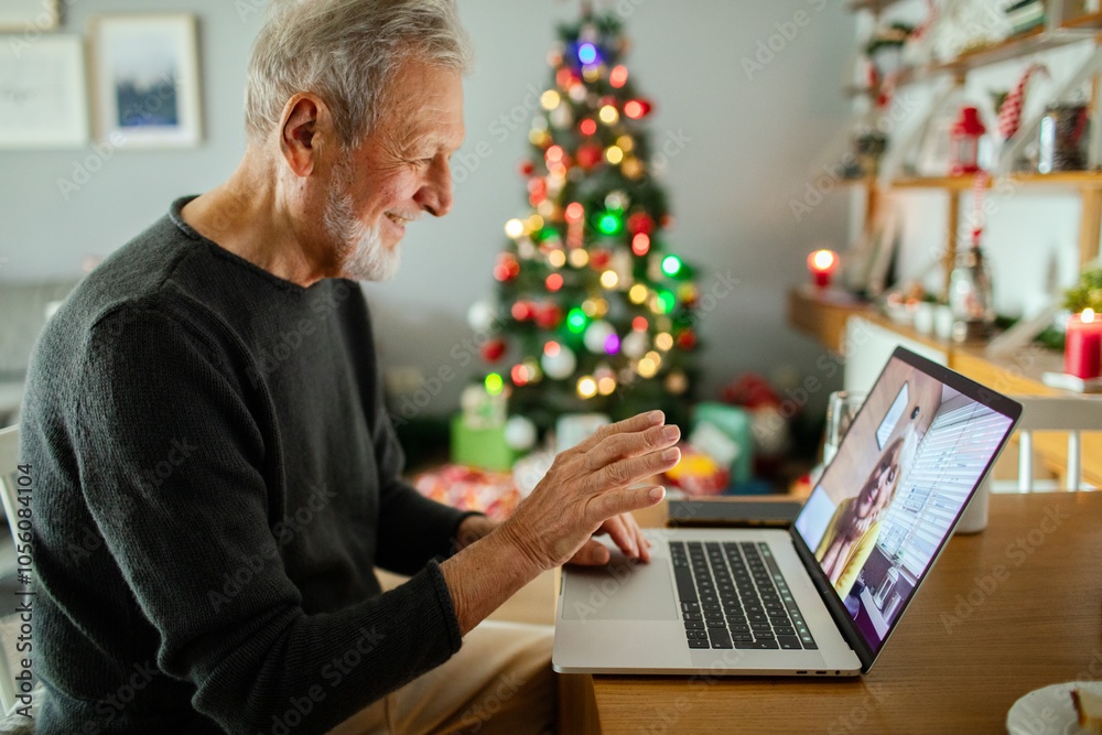 Senior man video calling wife while its Christmas home Senior man video calling wife while its Christmas home