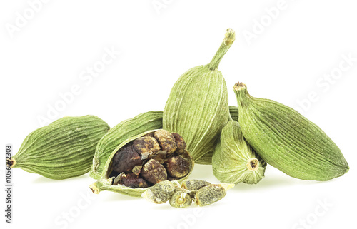 Green cardamom pods and seeds isolated on a white background. Dried cardamom spice.