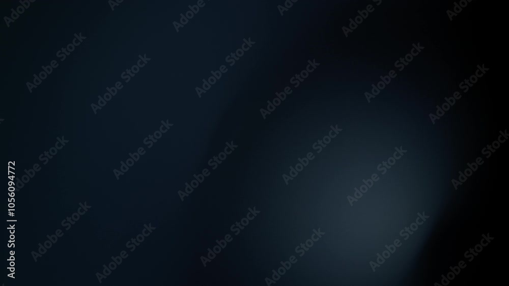 Blue lens flare overlay on a black background in slow motion. Blue lens flare overlay on a black background in slow motion.