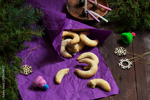 Obraz na płótnie Traditional advent cookies vanilla crescents on a purple background. Rustic style. w salonie
