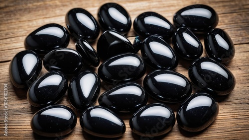 Shiny black apache tears displayed in a calming, natural setting. Their smooth texture and healing symbolism make them ideal for images showcasing holistic or spiritual themes. photo