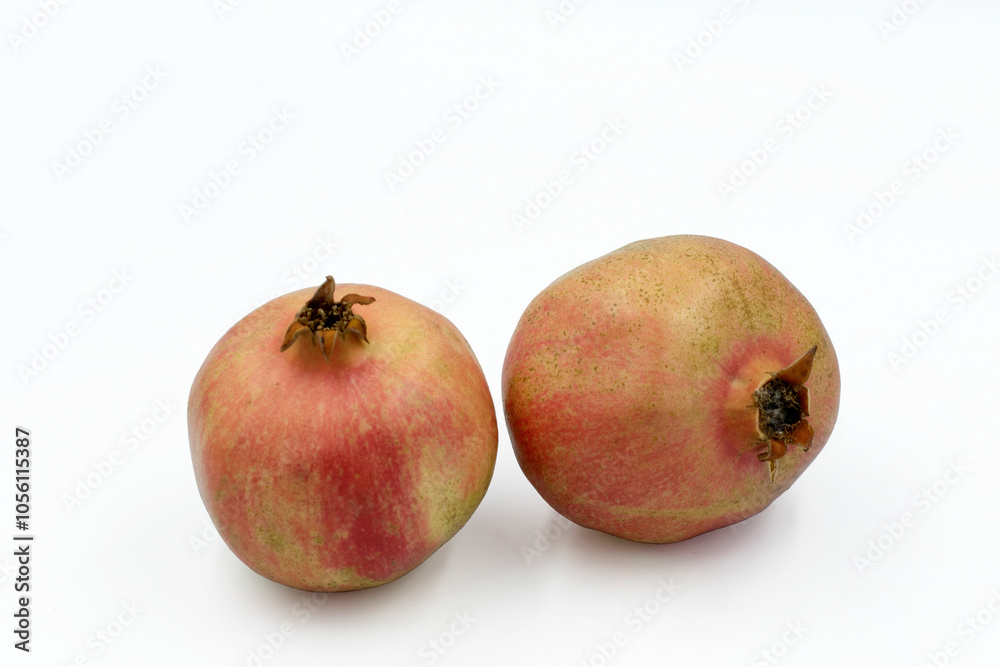 Two pomegranate fruits isolated on whte background