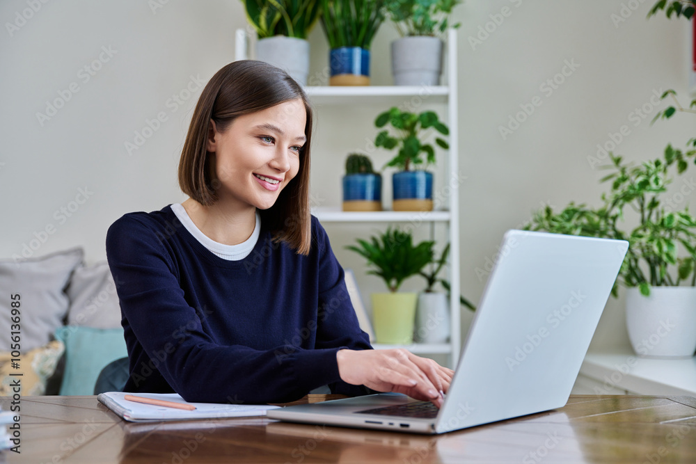 Young female using computer laptop for studying working Young female using computer laptop for studying working
