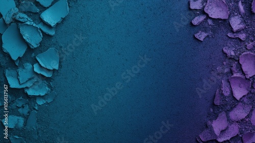 Abstract textured background with crushed blue and purple powder pigments on a smooth gradient surface.